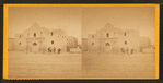 View of four men standing in front of the Alamo.