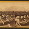 Bridge over the Weber River, Ogden in the distance.
