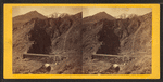 Devil's Gate from the south, the high peaks of the Wahsatch [Wasatch] in the distance. Union Pacific Railroad.