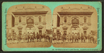 Ute Indians on the road to a grand pow-wow. Co-operative store for background.