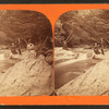 View of people on river (including woman with fishing pole).