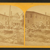 Group of men outside a mill.