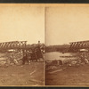 People among the debris near the railroad bridge, Marinette, Wisconsin