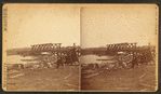People among the debris near the railroad bridge, Marinette, Wisconsin
