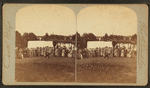 Gideon's Band. Brown's Lake, June 23 to 30, 1875. [Group of women looking at man kneelling, with tents in the background.]