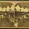 Interior view of W. L. Kidd's store in Laramie, showing wares in cases and hanging overhead.