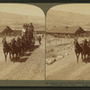 Six-horse tally-ho leaving mountain walled Gardiner for trip through Yellowstone Park, U.S.A.