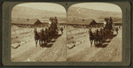 Six-horse tally-ho leaving mountain walled Gardiner for trip through Yellowstone Park, U.S.A.