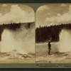 The 'Black Warrior' Geyser waving a banner of steam spray, Yellowstone Park, U.S.A.