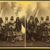 Crow Indian warriors. [Group posing in front of a teepee.]