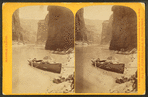 Marble Cañon, the cañon at noon. [Empty rowboat on the banks of the river.]