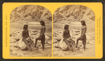 Types of Mojave Indians. [Two Mojave men pose on rocks in front of the river.]