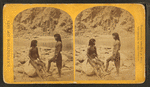 Types of Mojave Indians. [Two Mojave men pose on rocks in front of the river.]