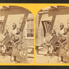 Navajo boys and squaw, in front of the quarters at old Fort Defiance, N.M., now occupied by troops.