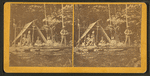 Indian camp in Maine, [showing family group sitting in front of tent].