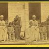 The New South family circle. [Family group on a porch.]