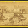 Uncle Bob at parade [rest?]. [Man and children resting around an oxcart, in town.]