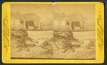 Uncle Bob at parade [rest?]. [Man and children resting around an oxcart, in town.]