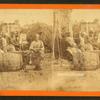 Boo-Peep. [Group of men and women seated outside, child peeking out of a barrel in the foreground.]