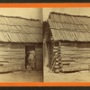 Happy little nig. [Woman and a small child in a cabin doorway.]