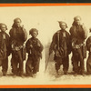 Studio portrait of three young chimney sweeps.