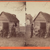 School house. [Man in a top hat in front of a shack with several boys with books.]