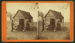 Uncle Abe's schoolhouse and scholars. [Man in a top hat in front of a shack with several boys with books.]
