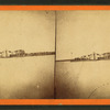 The Monitor off Charleston. [View with sailboat alongside and wash hanging out to dry.]
