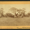 Filling their canteens. [Soldiers gathered at a well and "spring house."]