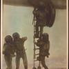 Divers descending from the submarine.