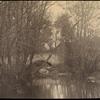 Stone bridge seen through trees