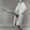 Angela Lansbury wearing fur coat, kicking up her left leg