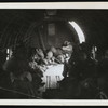 Katharine Cornell aboard a military transport plane