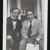 Harry Houdini and Howard Thurston sitting on a porch, possibly at Thurston's home in Beechhurst, Queens, N.Y.