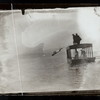 Harry Houdini diving off a boat into open water