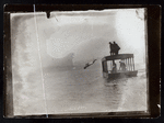 Harry Houdini diving off a boat into open water