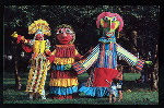 Three large rod puppets by Ronnie Asbell with two small children