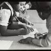 Schoolchildren working on the script for a puppet play