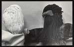Two hand puppets from behind