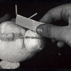 Styrofoam puppet head being sanded