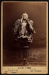 George Thorne as "Ko-Ko" in the D'Oyly Carte Opera Company stage production The Mikado