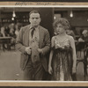 Scene from the 1916 silent film Reggie Mixes In