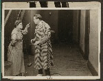 Scene from the 1916 silent film Reggie Mixes In