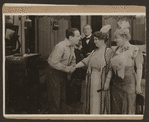 Scene from the 1916 silent film Reggie Mixes In