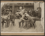 Scene from the 1916 silent film Reggie Mixes In