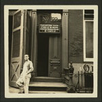 Unidentified person standing outside the Provincetown Playhouse in New York City