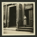 Unidentified person standing outside the Provincetown Playhouse in New York City