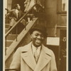 Bill Robinson on street in Harlem