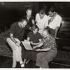 1952 Music Period, group looking at score