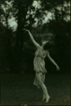 Irma Duncan dancing in a garden